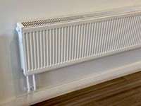 Modern wall-mounted radiator providing efficient heating for indoor spaces.